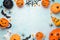 Modern Halloween frame border background  with pumpkin and decorations. Greeting card or party invitation mock up. Top view with