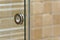 Modern handle on glass door in bathroom