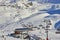 Modern high speed gondolas take hundreds of snow skiers up to the ski field of Ischgl in Austria to make the best of the Winter co