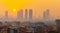 Modern highrise rich buildings and poor slums at sunset with air pollution. Generative AI