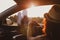 Modern hipster girl resting in a car and admiring view. Woman driver watching sunset put feet on car door. Feet outside the window