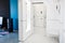 Modern home hallway interior. White plactic panels and tiles. Futuristic interior concept design. Space ship at home.