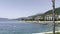 Modern hotels on the pier at the foot of the green mountains