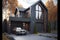 Modern house in dark graphite tones with convenient entrance and garage