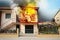 Modern house engulfed in flames. Fire safety violations