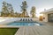 Modern house garden swimming pool and wooden deck