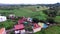 Modern housing community at the foot of mountain rain-forest. Drone Aerial