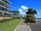 Modern housing complex with sidewalk at river