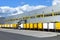 Modern industrial buildings in transport - loading of goods on trucks of a forwarding agency for export