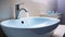 Modern interior bathroom sink with blue mirror backlight. White ceramic washbasin in contemporary minimalism style. Generative AI
