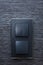 Modern interior design details - black switches and elegant wallpaper