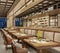 Modern interior design of restaurant lounge, oriental arabic style with wire mesh ceiling and hidden lights,  wood and bronze gold