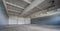 Modern interior of huge empty concrete industrial warehouse.