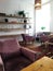 Modern interior. Pink velvet retro armchairs. Stylish composition of cafe  interior. Vintage furnitures. Decor of living rooms