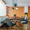 Modern italian design dining room with small fireplace and orange plaster walls, mock-up