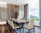 Modern italian interior design of contemporary dining room with beautiful view on countryside, mountain in background