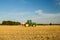 Modern john deere tractor Tractor spraying field stubble crops