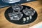 Modern kitchen equipment concept black tempered glass round shape gas hob with cast-iron grill with three gas burners on brushed