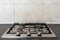 Modern kitchen gas stove cooker with metal burner on countertop