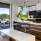 A modern kitchen with glossy white cabinets, a quartz waterfall island, and pendant lights hanging above a sleek dining area1, G