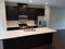 Modern kitchen with granite countertop and cabinets