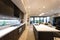 Modern kitchen illuminated with ceiling lights at day time