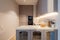 Modern kitchen interior with kooking space, oven and glass cupboard. Light decorations