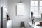 Modern kitchen interior with white walls, white countertops, white cupboards and a vertical poster. AI Generative