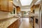 Modern kitchen room with matte brown cabinets, shiny granite tops