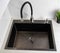 Modern kitchen sink with detergent dispenser and faucet with curved movable hose. Kitchen faucet with curved spout