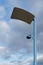 Modern lamppost in front of a dramatic sky