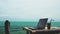 Modern laptop on table beside tropical sea. Digital Nomad in Thailand, Asia. Remote Work and Freelance Concept. Business