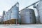 Modern large granary agro silos elevator on agro-processing manufacturing plant for processing drying cleaning and