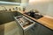 Modern large luxury dark gray kitchen with pulled out drawer