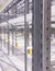 Modern large warehouse space interior, new and modern distribution storage with rows of empty high shelves and racks, concrete and