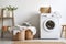 Modern laundry room with natural wicker laundry baskets and washing machine