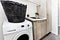 Modern laundry room with a washing machine and basket