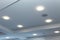 Modern layered ceiling with embedded lights and stretched ceiling inlay, lights on