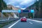 Modern LED traffic signs on highway, red car, truck on road