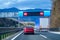 Modern LED traffic signs on highway, red car, truck on road