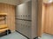 Modern and light locker room for sports facilities like school or gym with all lockers closed and locked for protection of the