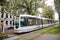 Modern light rail city tram passing through the city of Rotterdam