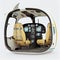 Modern light sport helicopter cabin dashboard, steering wheel, pilot and passenger seats.