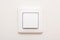 Modern light switch on white wall