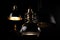modern lighting fixtures and lamps on a black background