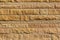 Modern limestone block wall background with beautiful rough natural texture