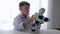 Modern little boy mounting automated robot with Artificial Intelligence