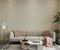 Modern livin groom with sofa and pink pillows and coffee table and lamp wall mockup