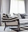 Modern living room with black and white checked pattern pillows