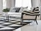 Modern living room interior with black and white checked pattern pillows and carpet